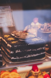 a display case filled with lots of different types of cakes