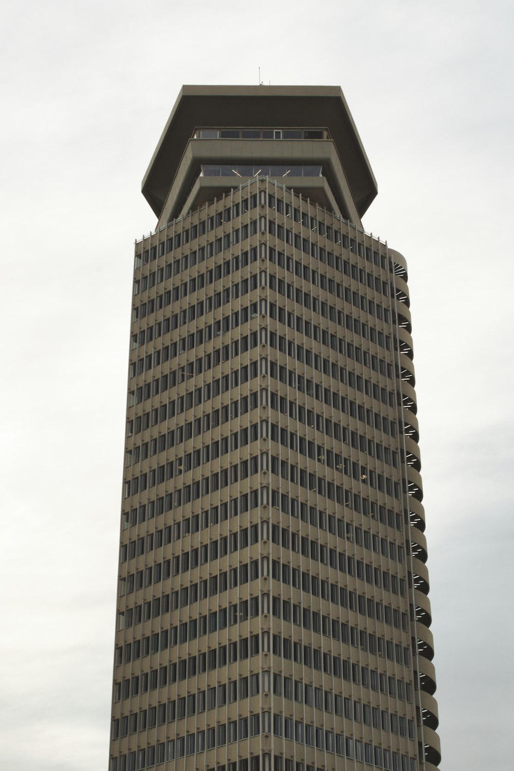 a tall building with a clock on the top of it