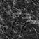 A textured black marble surface with intricate white veining patterns creating a sophisticated and elegant appearance.