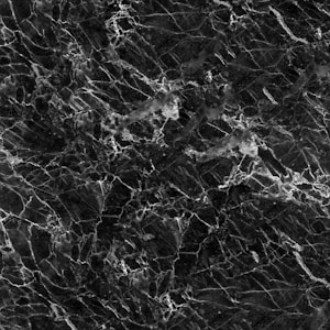 A textured black marble surface with intricate white veining patterns creating a sophisticated and elegant appearance.