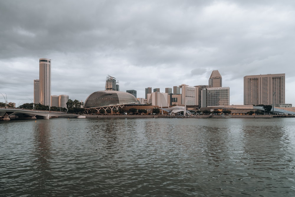 a large body of water with a city in the background