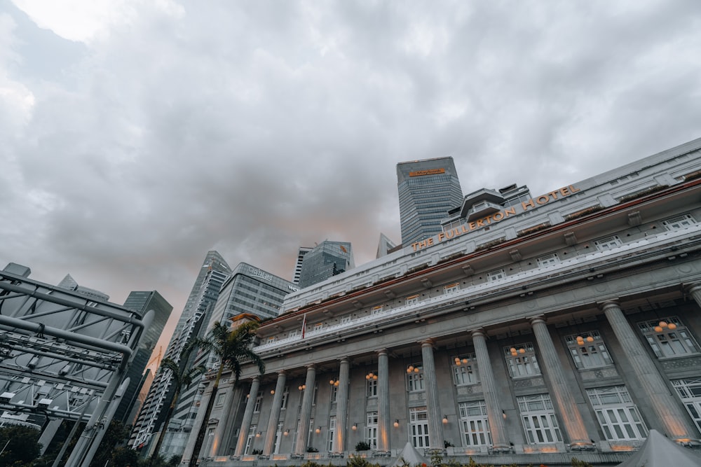 a large building with columns and a sky background