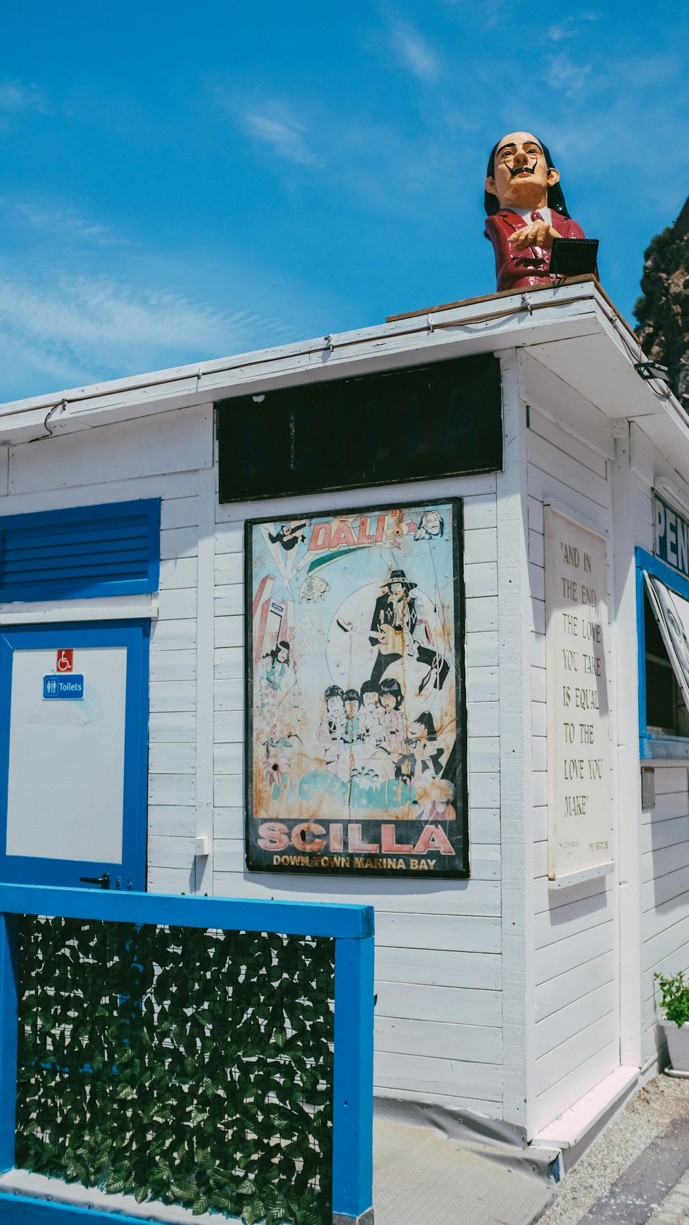 a small building with a sign on top of it