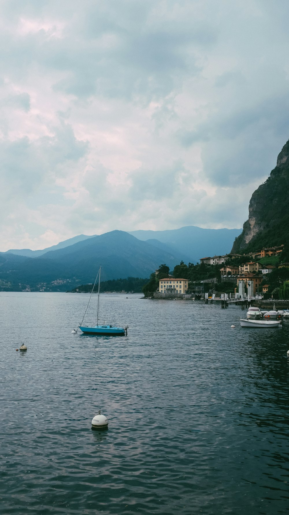 a body of water with boats floating on top of it