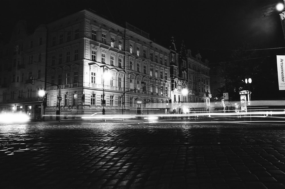 a black and white photo of a building at night