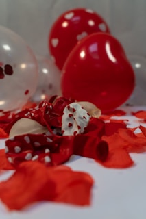 A romantic balloon heart centerpiece surrounded by soft drapes and candles.