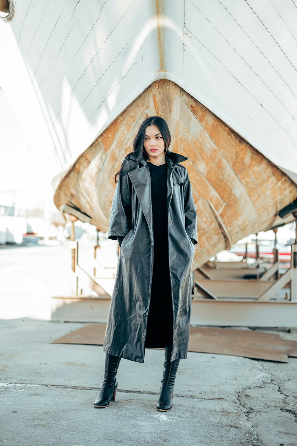 a woman standing in front of a boat