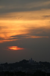 A scenic view of the ghats in Mathura during sunset.