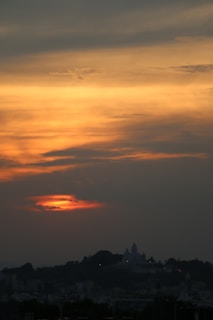 A scenic view of Jaipur's iconic Hawa Mahal at sunset.