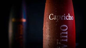 Close-up of Água Mineral Croatá 500ml and 1.5L bottles with droplets of condensation.