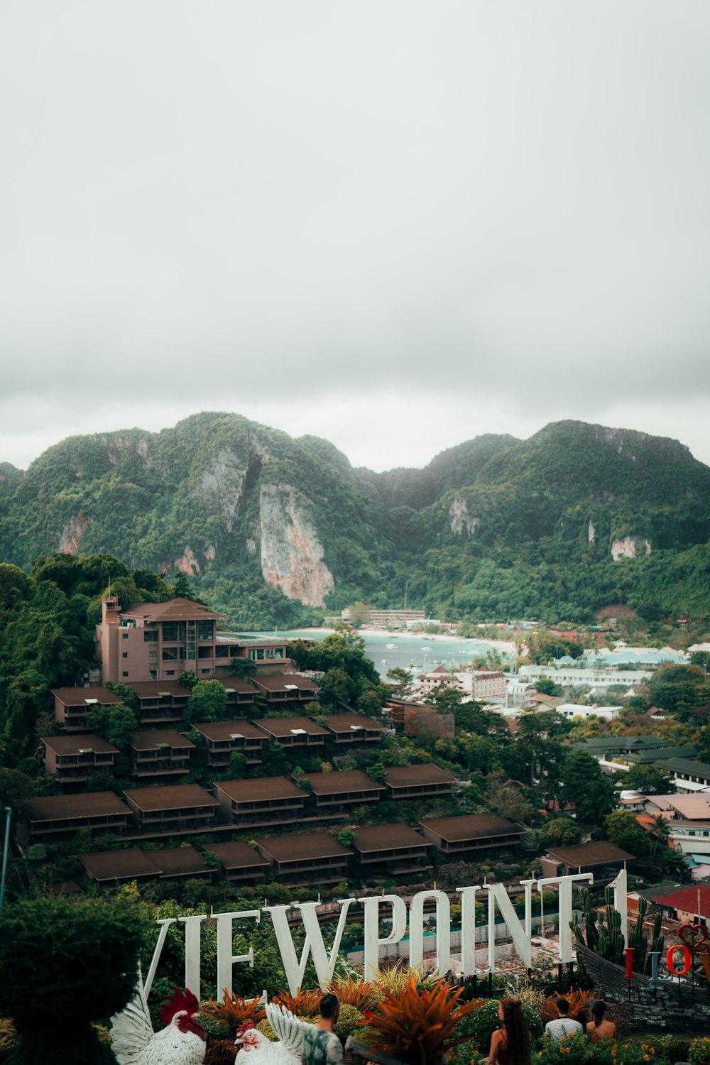 a view of a town with mountains in the background