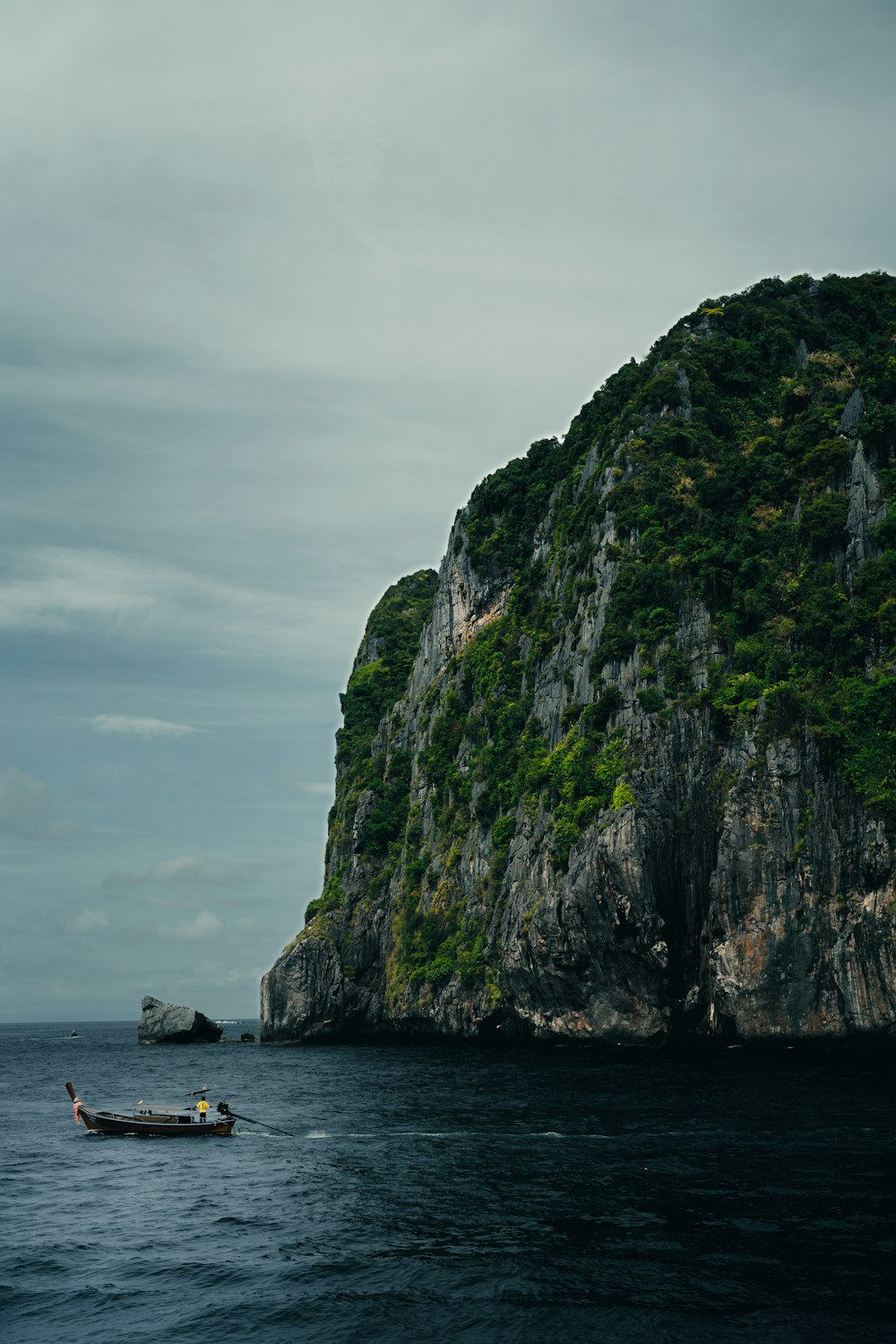 a small boat in the middle of a body of water