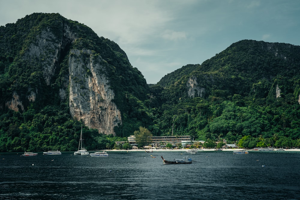 a group of boats floating on top of a body of water