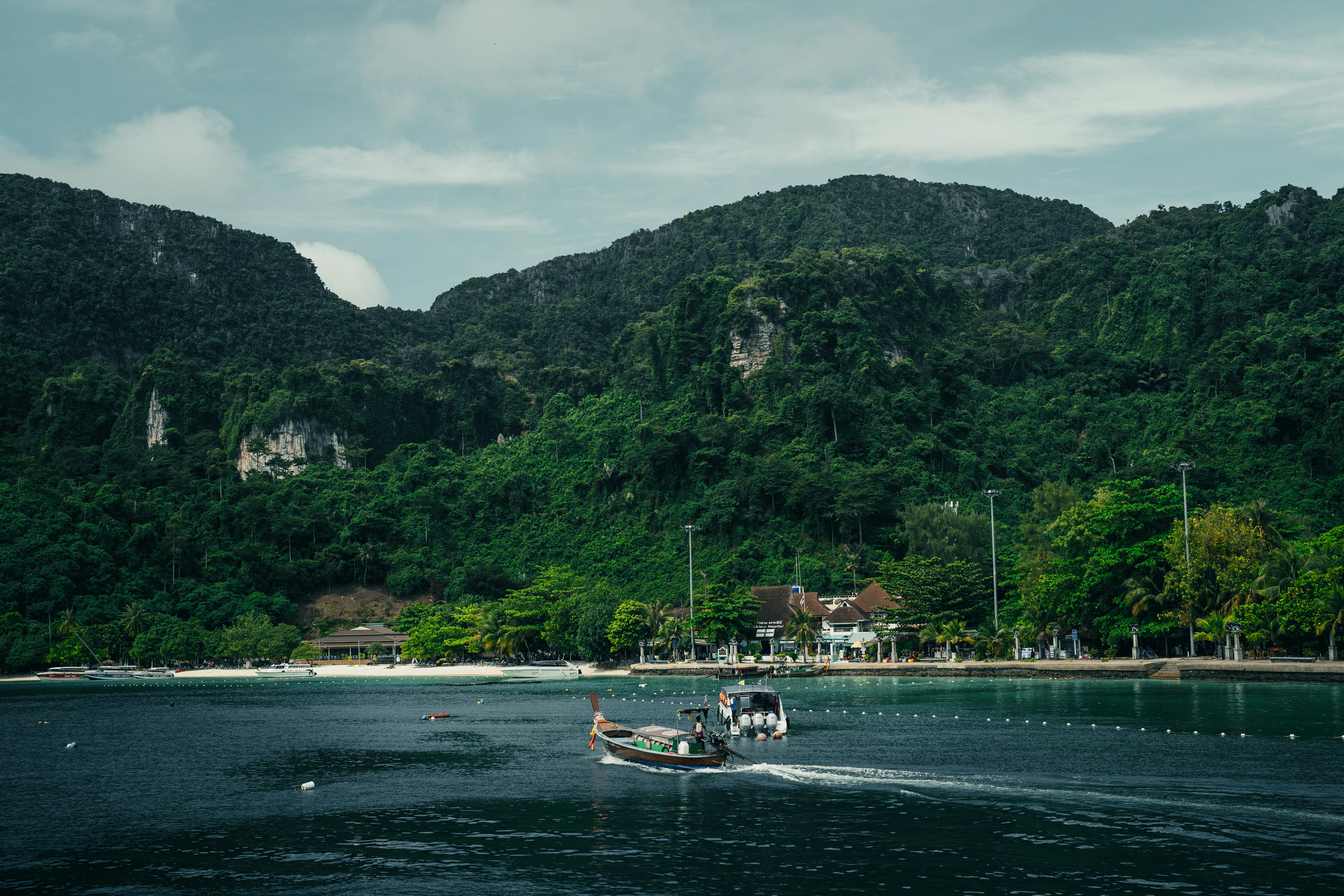a boat is traveling on a body of water, Koh Phi Phi Don, Thailand ∤ 2022