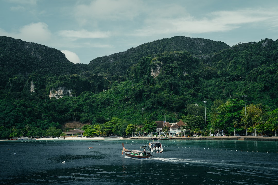 a boat is traveling on a body of water, Koh Phi Phi Don, Thailand ∤ 2022
