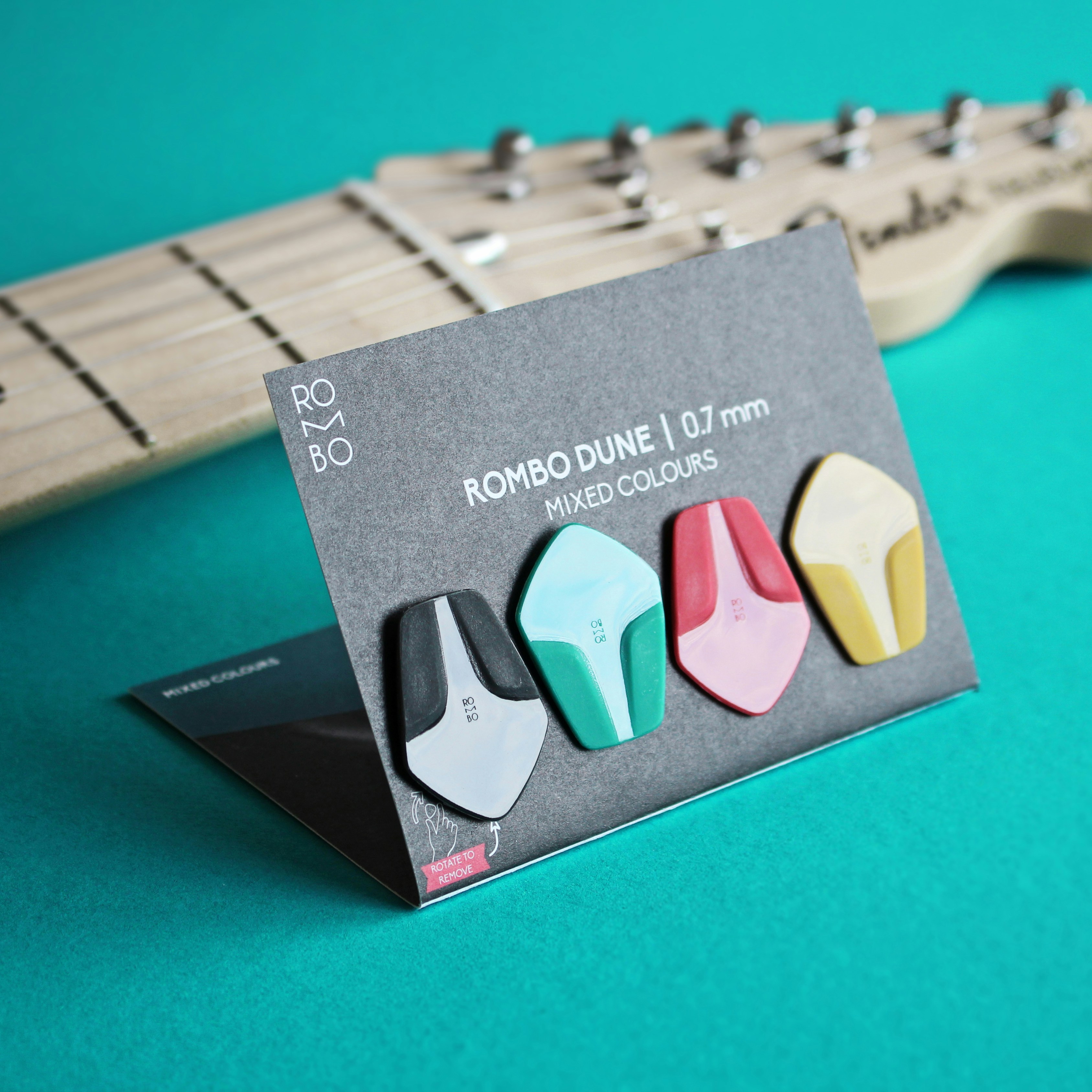 A close up of a guitar picker near a guitar photo – Free Guitar gear ...