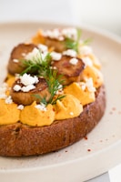 Close-up of a creamy no-cook filling spread on a fresh slice of bread.
