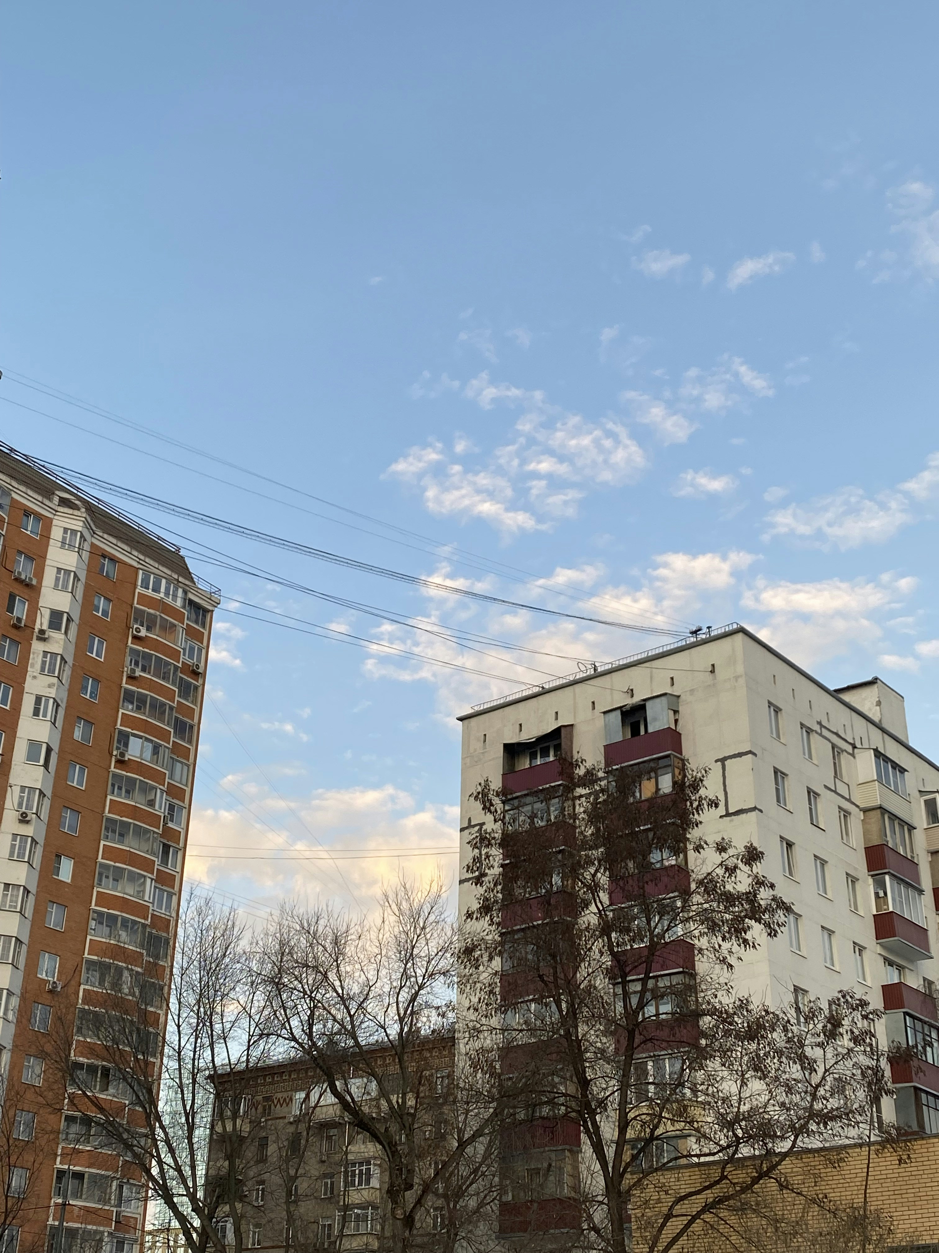 a couple of tall buildings sitting next to each other