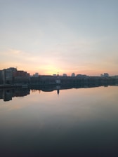 A calm sunrise over a city skyline symbolizing new beginnings and hope.