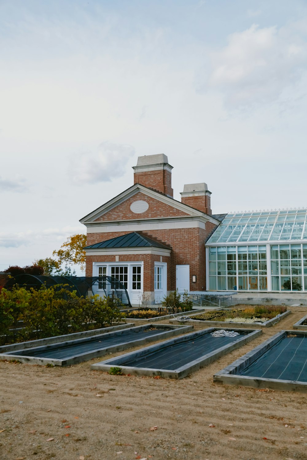 a brick building with a clock on the top of it