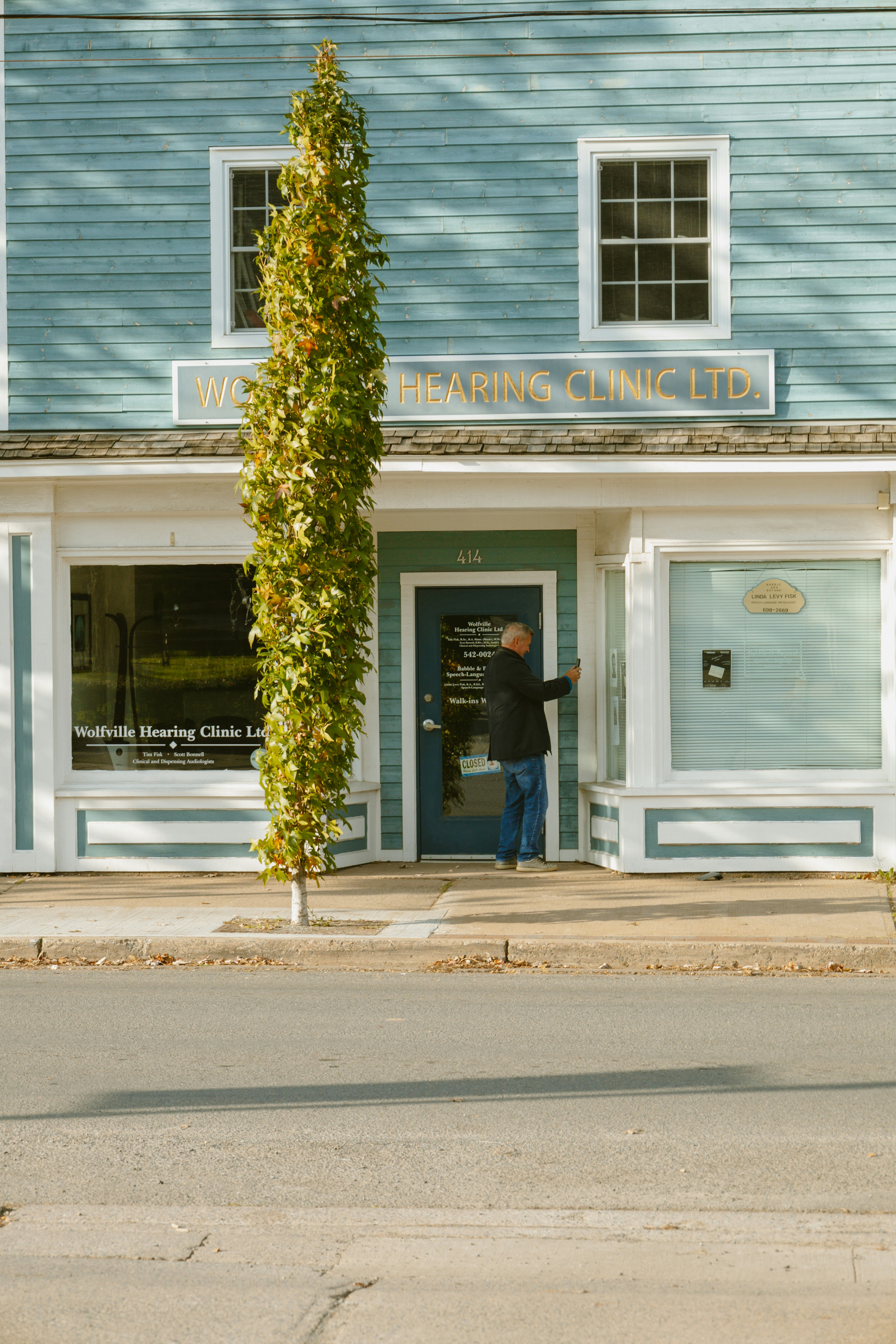 woman wearing yellow long-sleeved dress under white clouds and blue sky during daytime