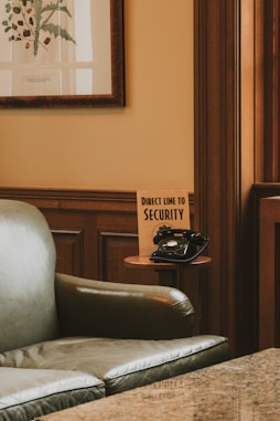 a chair with a sign that says direct time to security