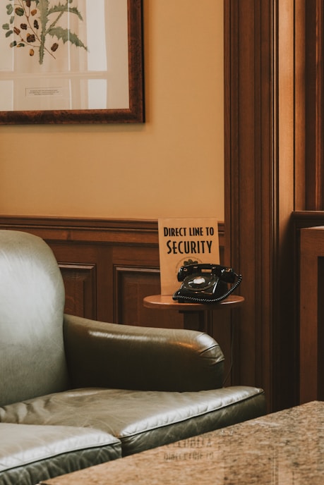 a chair with a sign that says direct time to security
