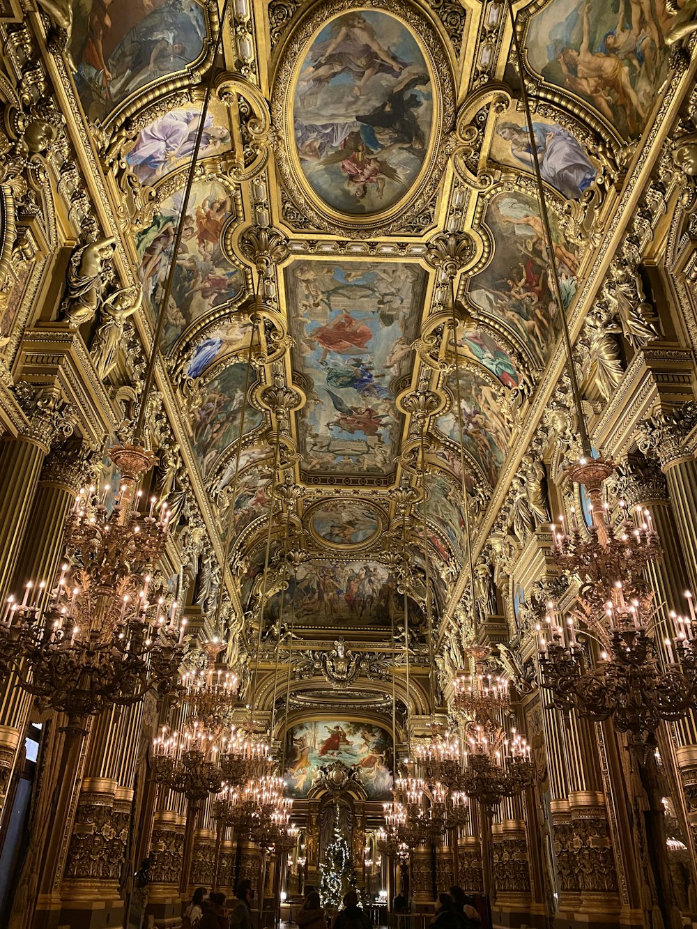 the ceiling of a building with a painting on it