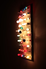 A display of LED bulbs in different shapes and colors.