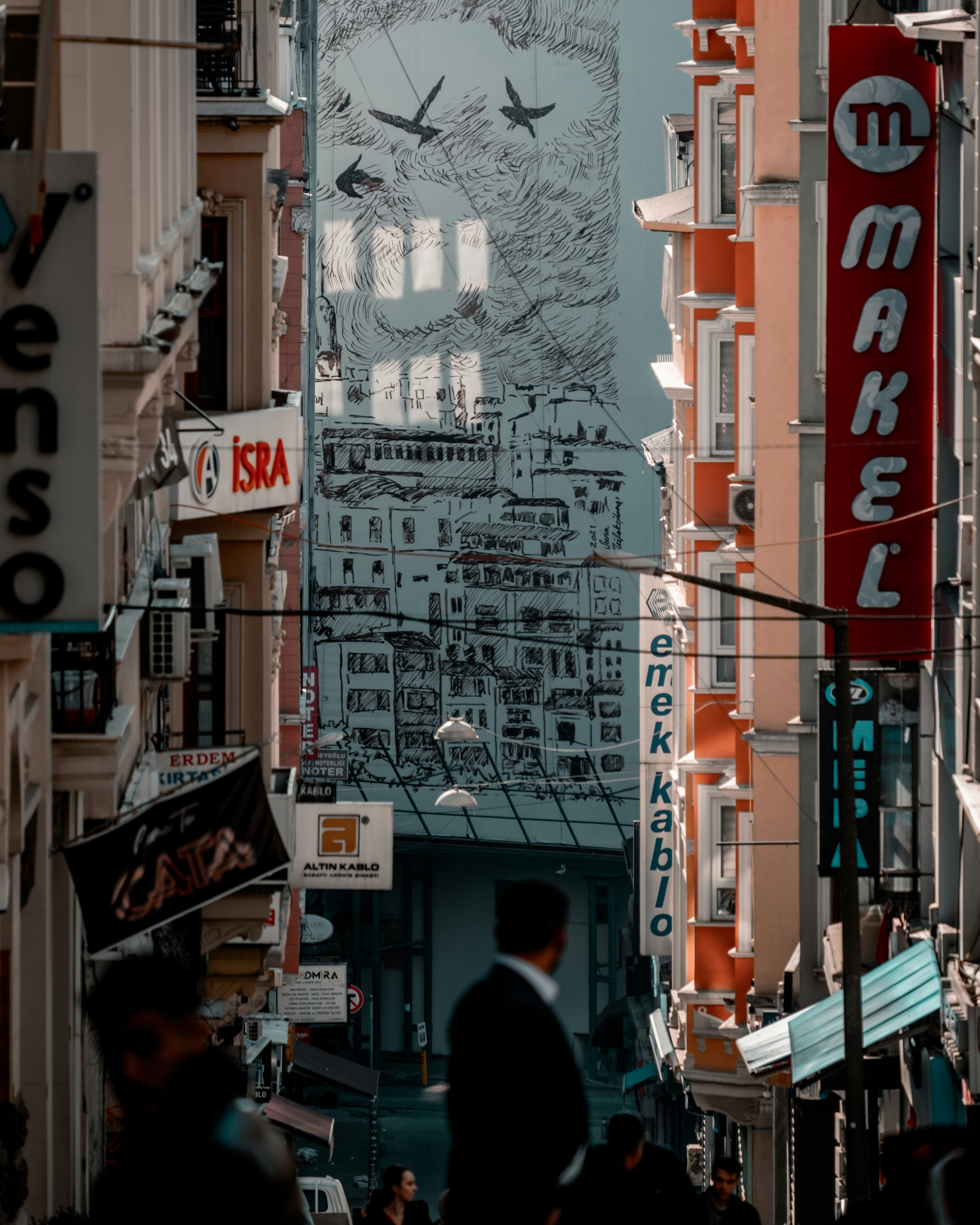 a city street filled with lots of tall buildings