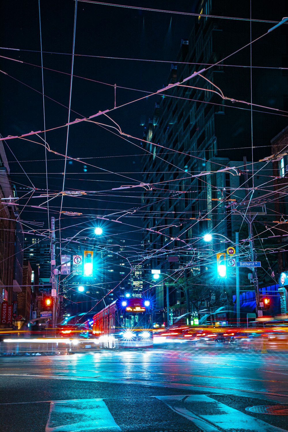 a city street filled with lots of traffic at night