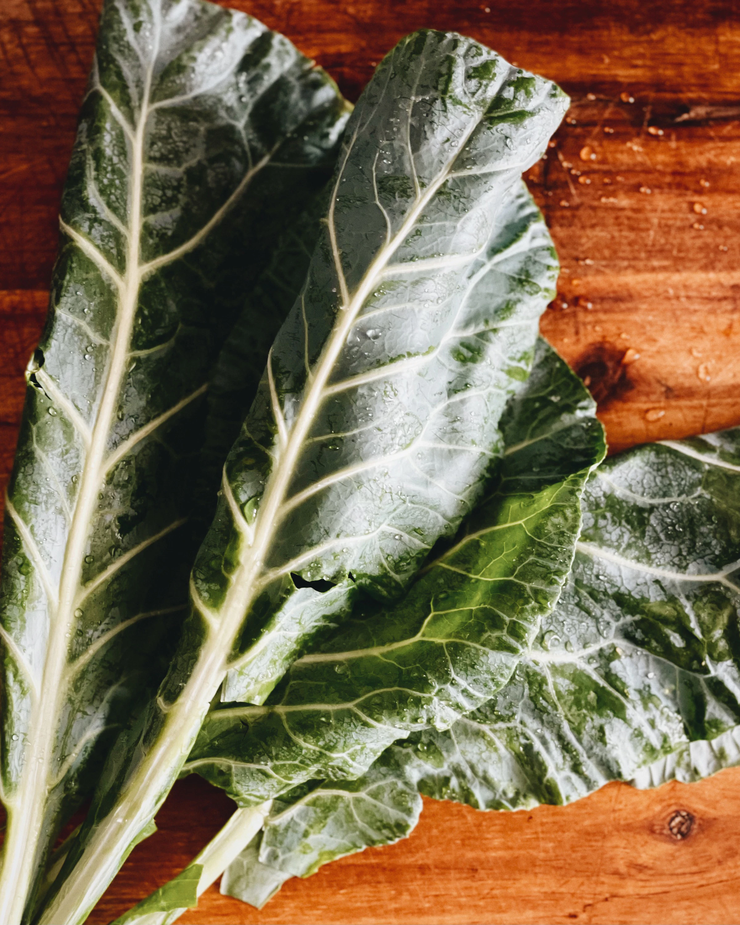 Fresh collard greens on a cutting board