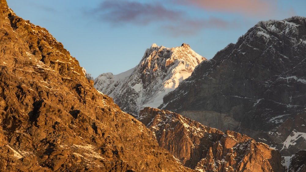 a view of a mountain range with snow on it