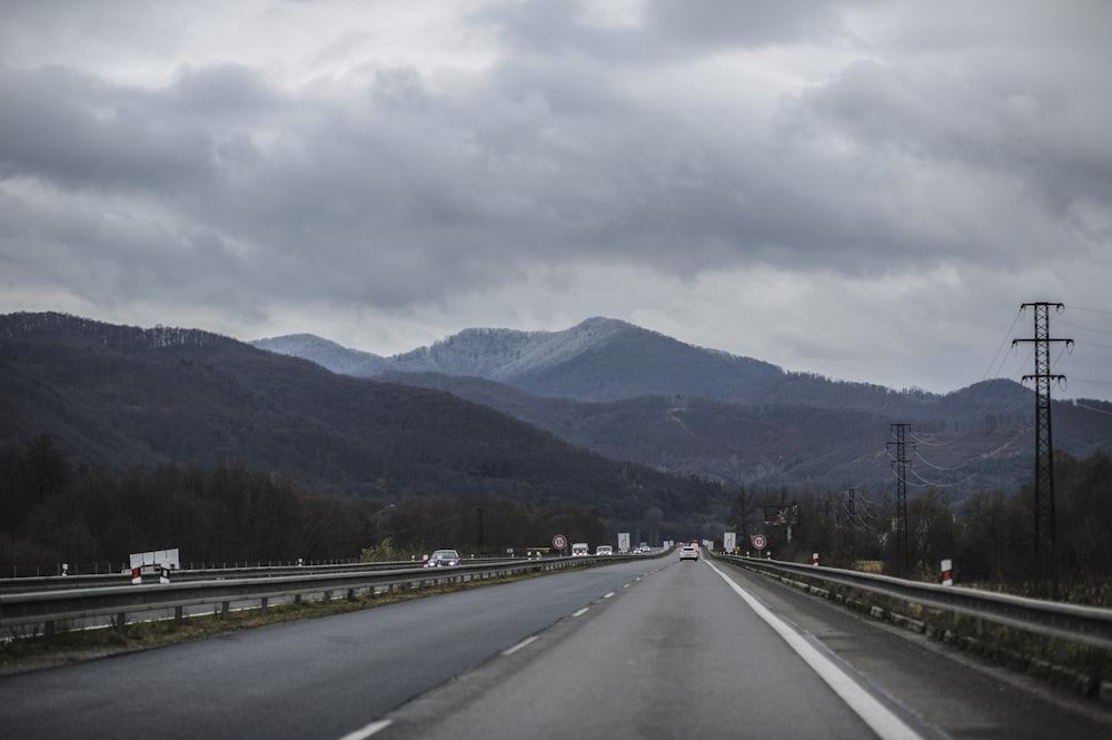 a highway with mountains in the background