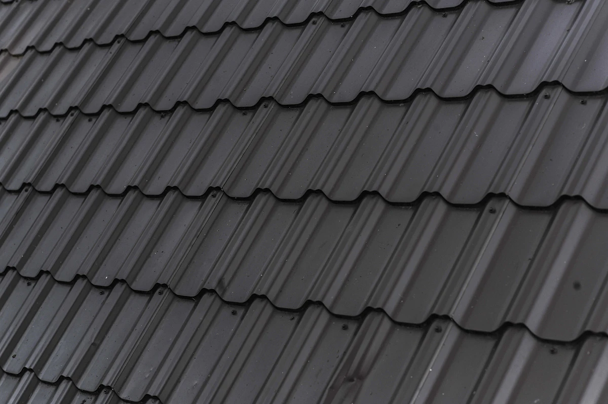 Close-up of dark architectural shingles on a finished roof