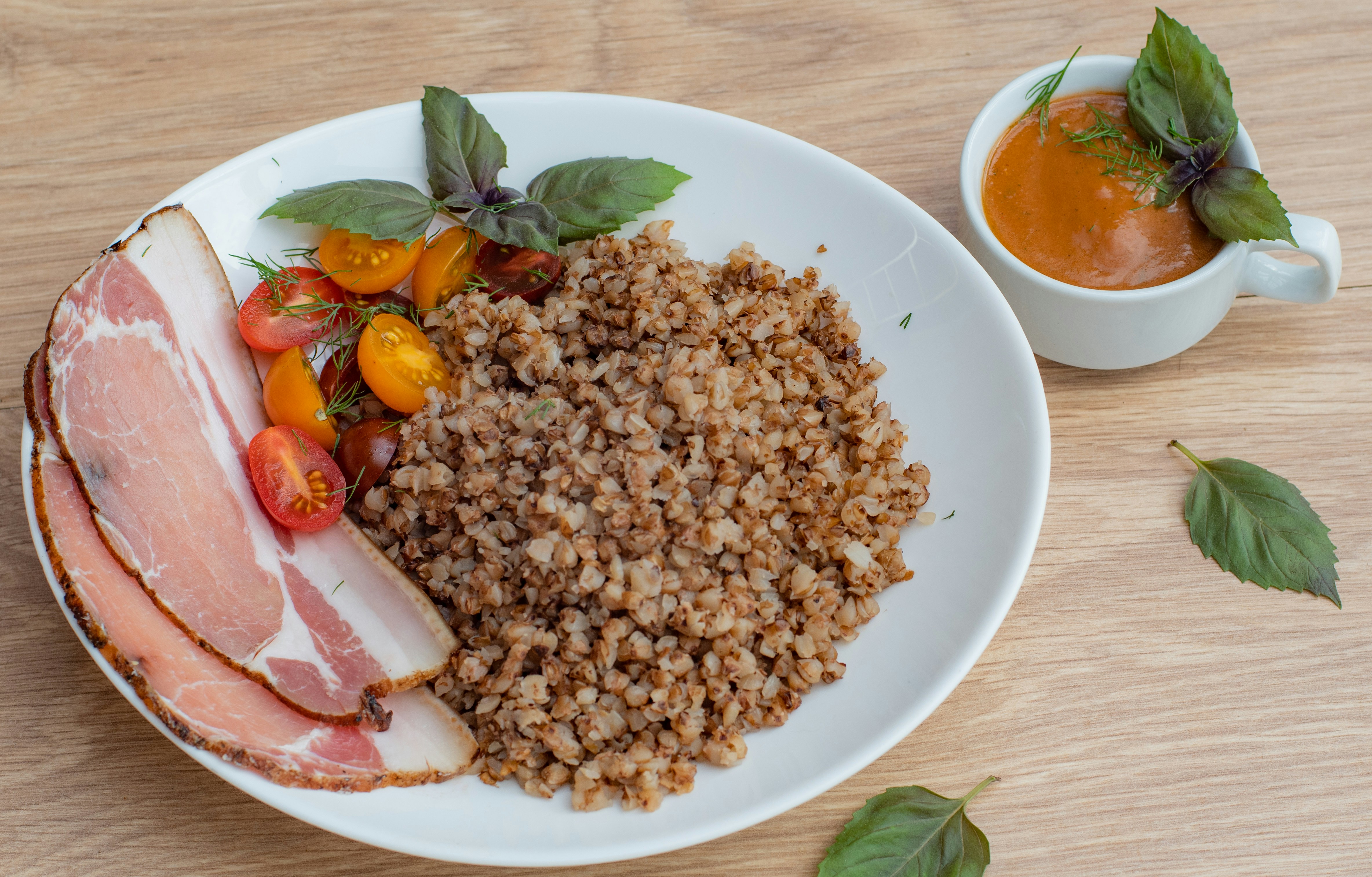 a white plate topped with meat and vegetables