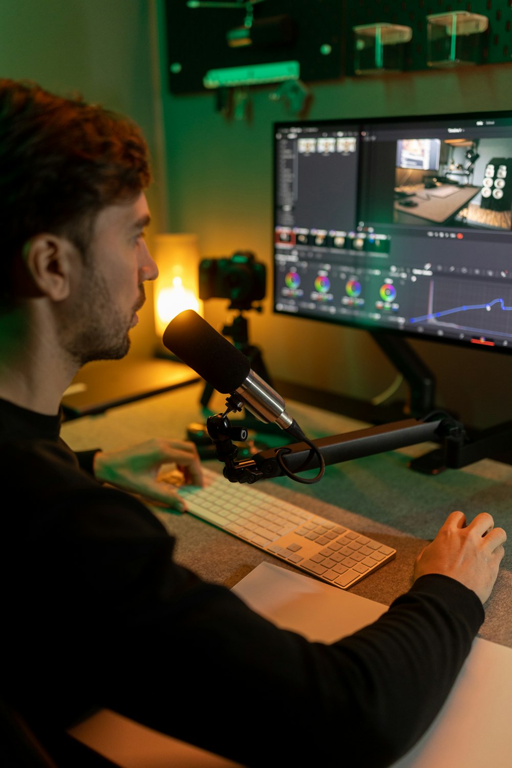 a man sitting at a desk in front of a computer