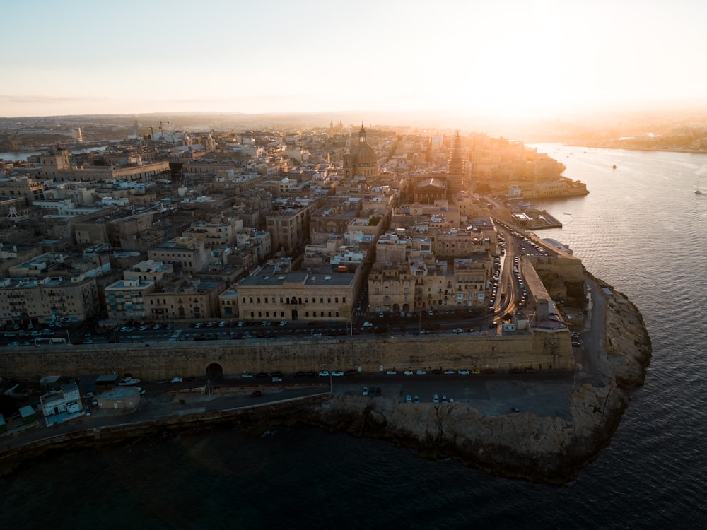 an aerial view of a city and a body of water