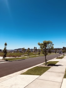 Freshly paved asphalt street with smooth surface in a residential neighborhood.