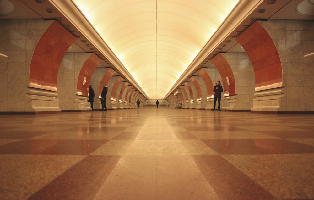 a group of people standing in a tunnel