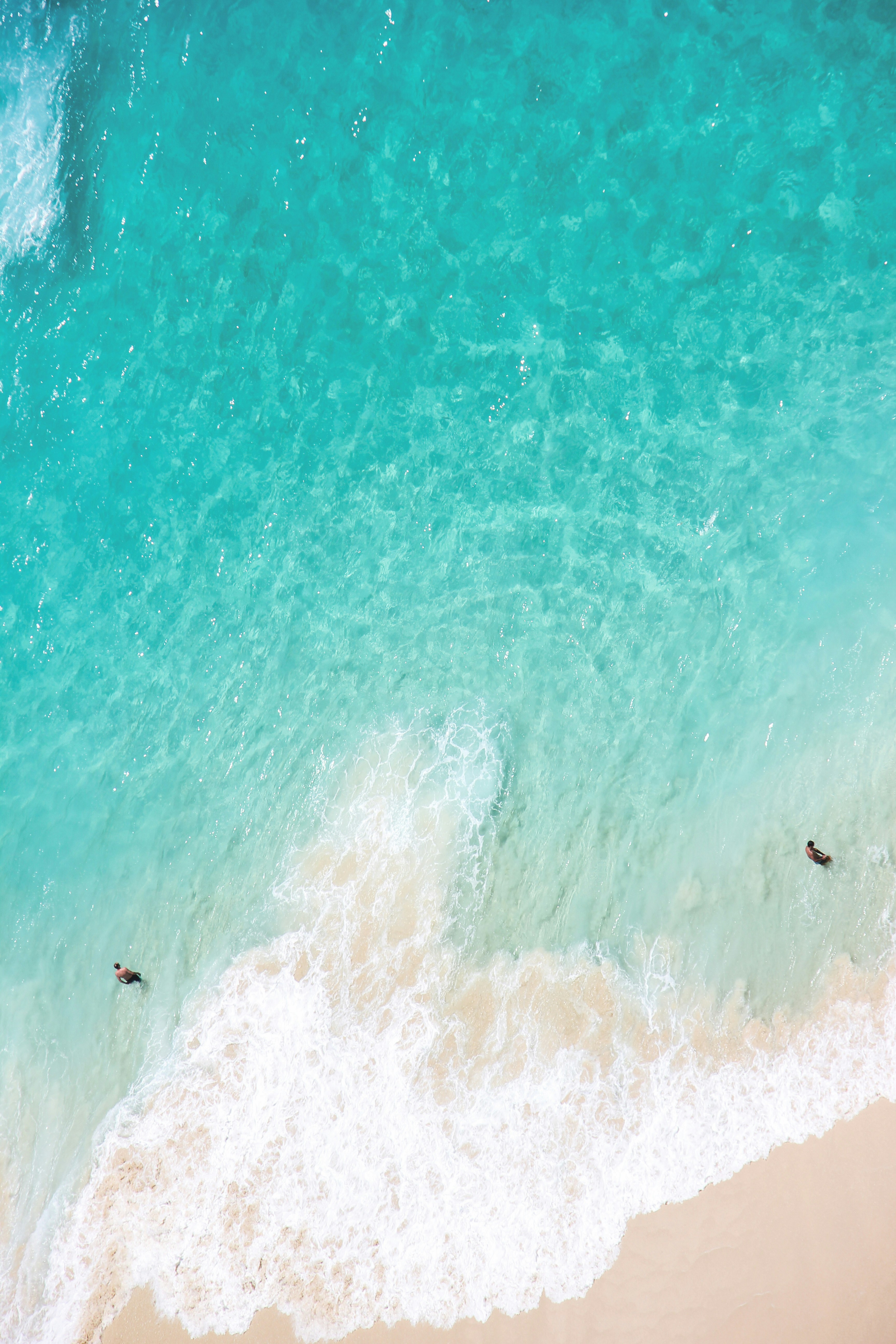 A beautiful beach with turquoise water and white sand.