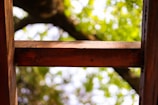 Close-up of skilled carpenter fitting wooden beams on a residential roof.