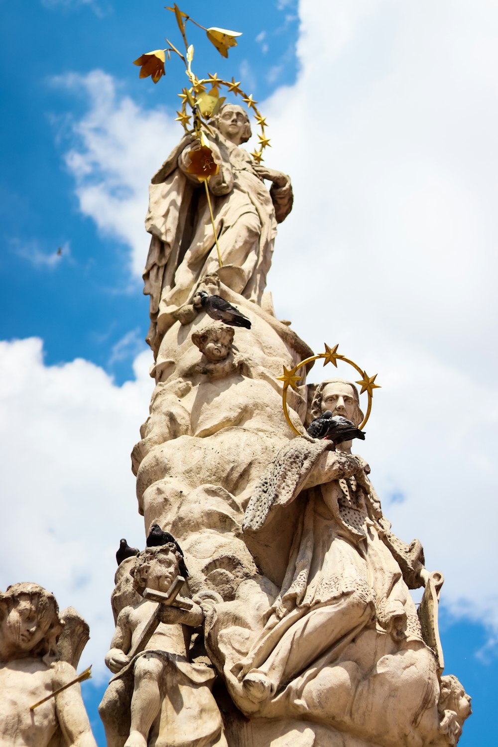 a statue of a woman holding a flower