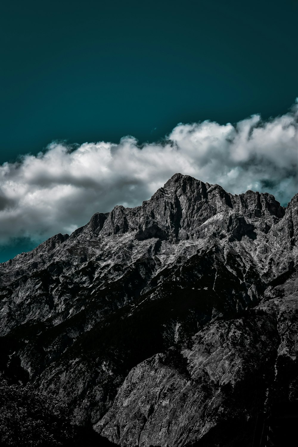 a black and white photo of the top of a mountain