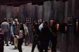 Audience wearing headphones, fully absorbed in an interactive sound installation.
