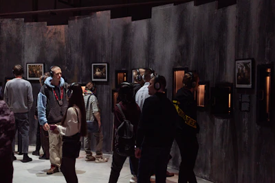 Audience wearing headphones, fully absorbed in an interactive sound installation.
