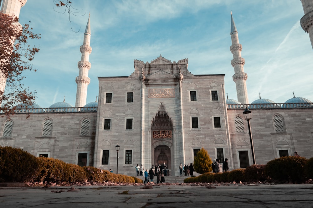 a group of people standing in front of a building