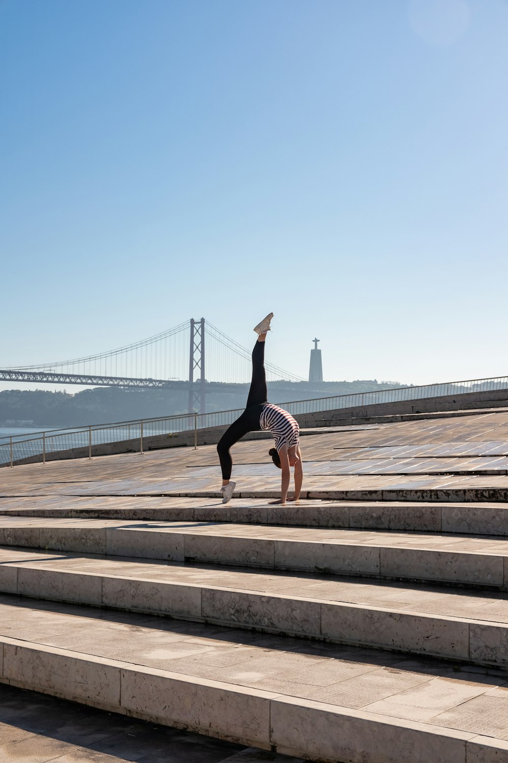 a person doing a handstand on some steps