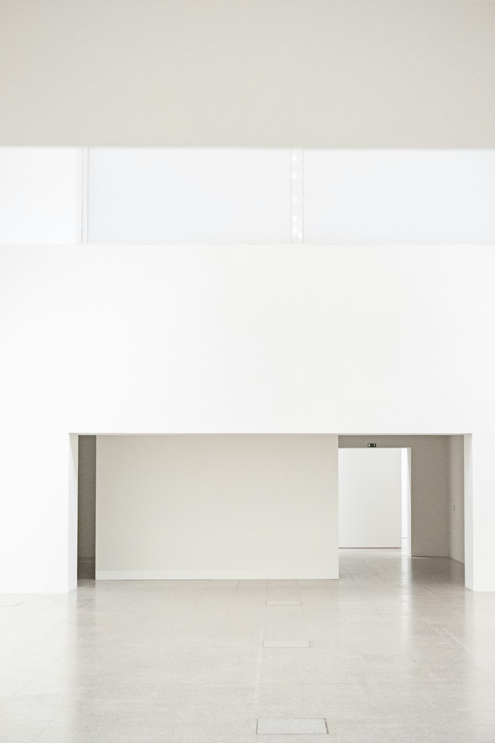 a white room with a white floor and a white wall