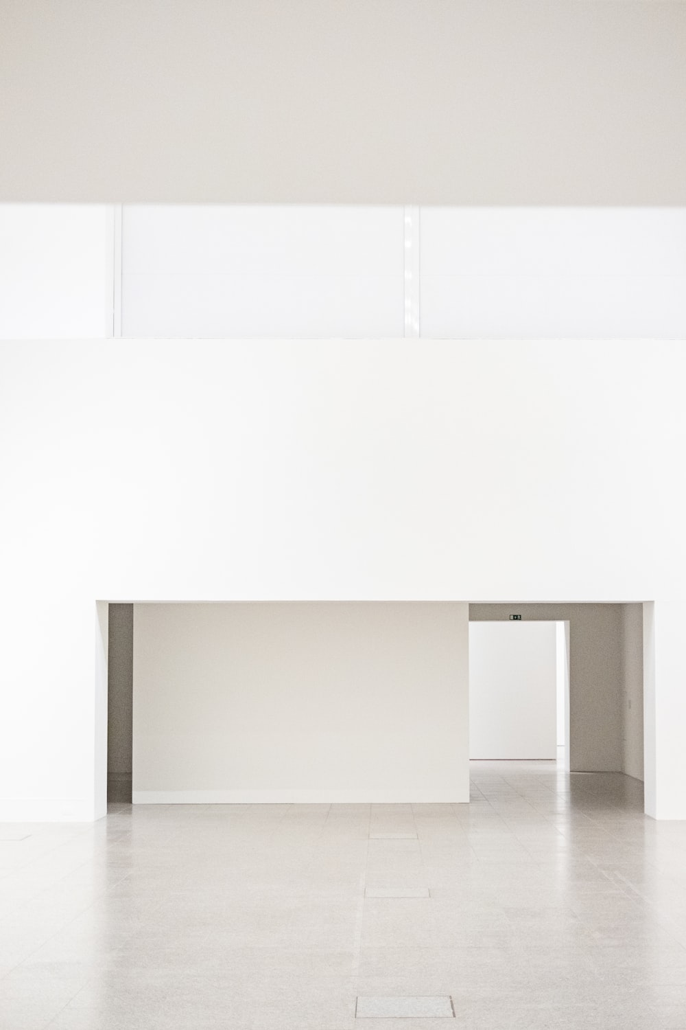 a white room with a white floor and a white wall